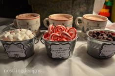 hot chocolates, marshmallows and pretzels are served in buckets