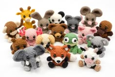 small crocheted stuffed animals are arranged together