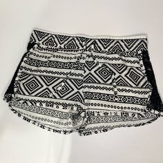 Step Out In Style This Summer With These Orageous Juniors' Shorts In A Bright White Aztec Pattern. The Crochet Insert Detailing Adds An Extra Touch Of Flair To These Stylish Shorts, Which Are Made From 100% Polyester Material. Perfectly Sized For Women In A Small Fit, These Shorts Feature An Elastic Waistband For Added Comfort And Flexibility. The Striped Pattern, Accented With Crochet Detailing, Adds A Trendy And Fashionable Look To These Shorts. They Are Perfect For Any Casual Outing Or Even A Black Lace Trim Shorts For Summer, Black Letter Print Beach Shorts, Black Lululemon Shorts, Levi 501 Shorts, Aztec Shorts, Stylish Shorts, Cutoff Jean Shorts, Hollister Shorts, Beach-style Mini Shorts With Floral Print