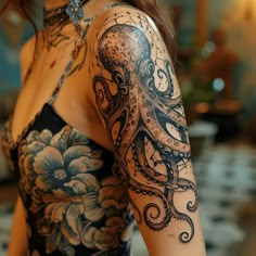 a woman with an octopus tattoo on her arm