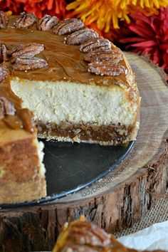 a piece of pecan pie cheesecake on a plate with the remaining slice cut out