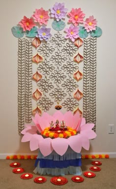 a decorated stage with candles and flowers on it