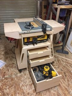 a workbench with tools in it on the floor