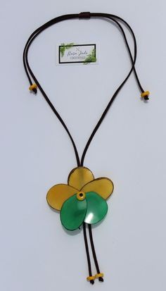 Handmade in Ecuador Necklace Length: 15 -35.5 Adjustable Length Material: Tagua Nut Handmade Clasp Due to this item being handmade and the nature of the Tagua Nut the size and the color may vary from piece to piece Adjustable Flower Pendant Necklace For Beach, Handmade Brown Flower Jewelry, Brown Flower-shaped Jewelry Gift, Bohemian Brown Flower Necklace, Yellow Flower Necklace For The Beach, Yellow Flower Necklace For Beach, Nature-inspired Brown Flower-shaped Jewelry, Adjustable Handmade Yellow Flower Necklace, Handmade Yellow Flower Necklace Adjustable