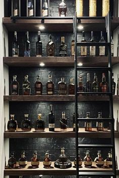 the shelves are filled with liquor bottles