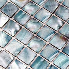 a close up view of a blue mosaic tile