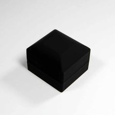 a black square object sitting on top of a white table