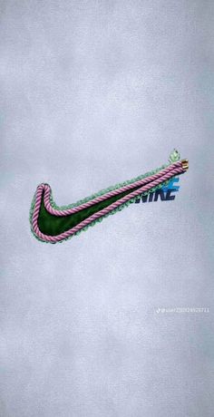 the nike logo is painted on top of a pink and green shoelaced tie