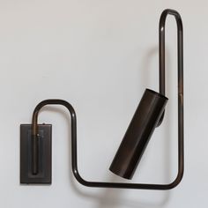 a wall mounted light with a metal holder