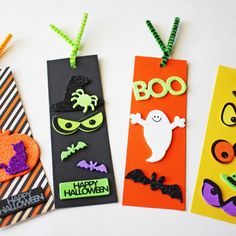 three halloween bookmarks with different designs on them