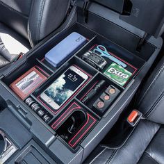 the interior of a car with various items in it