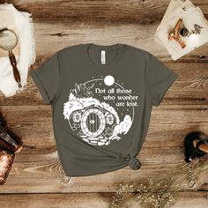 a women's t - shirt that says, do all those who wander are lost