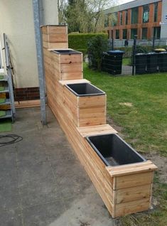 some wooden steps that are outside in the grass with plants growing out of one side