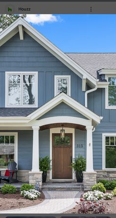 a house with blue siding and white trim