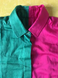 So cool 1980s Kenzo Paris color block cotton shirt. Wha! Its like you had a turquoise green shirt and it was exactly cut down the middle and attached to a hot pink shirt, so cool! The fabric is a medium weight brushed cotton with a slight sheen. Shirt is cut straight with no darts. Covered button placket with six mother of pearl buttons. Even the sleeve cuffs get in on the color block action! Fold over cuff with contrasting color on the inside. Super chic! Label Kenzo Paris, size 40, 100% cotton Summer Multicolor Contrast Color Shirt, Spring Green Color Block Shirt, Green Short Sleeve Color Block Shirt, Green Color Block Short Sleeve Shirt, Workwear Color Block Button-up Shirt, Casual Button-up Color Block Tops, Spring Color Block Button-up Shirt, Blue Color Block Button-up Shirt, Green Patchwork Button-up Shirt