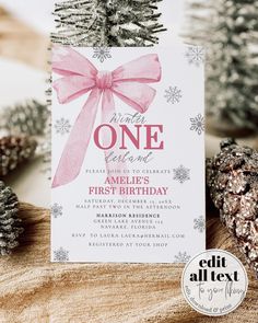 a birthday party with pine cones and pink ribbon on the front, one is for someone's first birthday