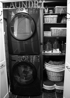 a washer and dryer in a small room next to an open door with the words laundry on it