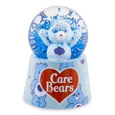 the care bears snow globe is blue and has an image of a teddy bear in it