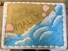 a birthday cake is decorated with seashells and the words, happy birthday mail