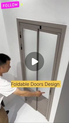 a man is opening the sliding glass door with his hand and pointing to it in front of him