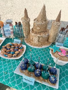 an assortment of desserts are displayed on a table