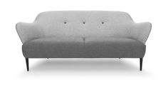 a gray couch sitting on top of a white floor