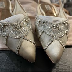 Anthropologie Bhldn X Badgley Mischka Hanna Flats Size 7 In Ivory Satin Have Wonderful Crystal Work With Ivory Satin And Mesh Details. These Beautiful And Comfortable Shoes Are Excellent Used Condition - They Were Only Worn Once And Are Practically Brand New! Product Details Twinkling Crystals Dazzle The Upper Of An Event-Ready Flat Perfect For Dancing With A Secure, Adjustable Slingback Strap. Adjustable Strap With Buckle Closure Cushioned Insole Textile And Synthetic Upper And Lining/Leather S Elegant Cream Flat Heels, Elegant Low Heel Embellished Wedding Shoes, Elegant Embellished Low Heel Wedding Shoes, Elegant Embellished Flat Heel Wedding Shoes, Elegant Embellished Flat Wedding Shoes, Low Heel Embellished Wedding Shoes, Evening Embellished Cream Heels, Embellished Cream Heels For Evening, Embellished Flat Heel Wedding Shoes For Evening