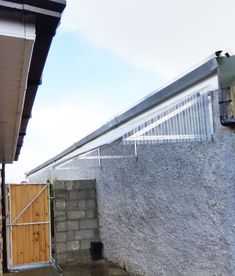 an outside view of a building with a gate