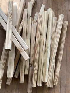 several pieces of wood sitting on top of a wooden floor