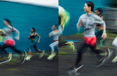 blurry photograph of people running on the street in front of a blue and white wall