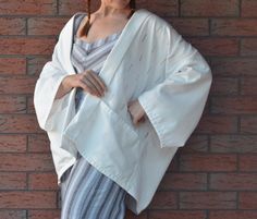 ✨Comfortable oversized kimono made of natural fabric.  🧵All seams are finished with bias binding. 📏Suitable for size L Made for those who love comfort and unique things, and for those who support sustainable fashion💚 Handmade White Kimono For Spring, Cotton Kimono With Natural Dye And Relaxed Fit, Spring White Handmade Kimono, Spring Loungewear Kimono With Natural Dye, Embroidered V-neck Beach Kimono, Embroidered One-size Summer Kimono, Cotton Kimono, Womens Kimono, Kimono Jacket