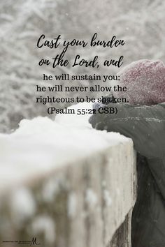 a person sitting in the snow with a bible verse