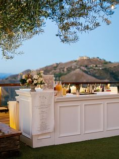 an outdoor bar is set up on the grass