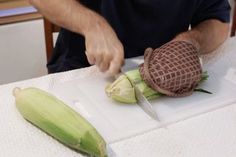 a man cutting up some food on top of a table