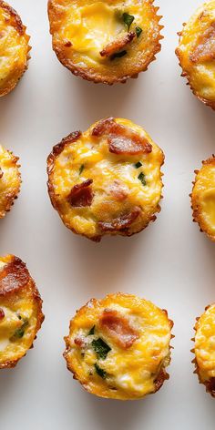 several small muffins with cheese and bacon on them