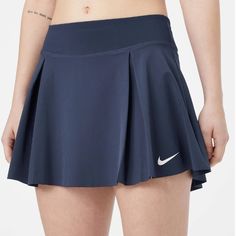 Your Team Spirit Will Rev Up Into High Gear On Game Day With The Nike Team Club Skirt. It Features An Elastic Waistband With Small Inner Pocket At Back, A Flouncy Silhouette With Two Pleats In The Front, A Built-In Ball Short With Right-Side Pocket, A Laser-Cut Hemline, Dri-Fit Moisture Wicking Performance, And A Nike Swoosh At Left Hem. Content: Body: 86% Polyester, 14% Spandex / Short: 83% Polyester, 17% Spandex Built-In Ball Short Dri-Fit Sweat-Wicking Performance Made With At Least 75% Recyc Nike Skirted Tennis Skirt With Lining, Nike Fitted Pleated Skirt, Nike Tennis Skirt With Lining, Fitted Nike Pleated Skirt, Nike Tennis Skirt For Spring, Fitted Blue Tennis Skirt, Navy Pleated Tennis Skirt, Navy Fitted Tennis Skirt, Nike Casual Pleated Skirt