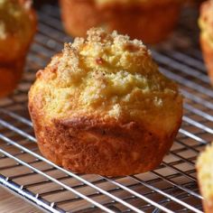 lemon ricotta muffins on a cooling rack with the title overlay reads, lemon ricotta muffins