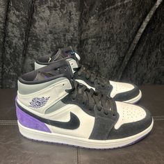 The Air Jordan 1 Mid Se 'Varsity Purple' Features A Familiar Palette Executed In Non-Traditional Color Blocking. A White Leather Upper Is Fortified With Black Suede Overlays Around The Forefoot And Purple Suede Paneling On The Heel. A Classic Wings Logo Is Stamped In Matching Purple On The White Leather Collar Flap, While An Unexpected Pop Of Pink Accents The Tongue Tag. Underfoot, A Purple Rubber Outsole Offers Grippy Traction. Release Date: 09-06-20 Sku: 852542 105 Designer: Peter Moore Nickna Purple Basketball Shoes With Laces For Streetwear, Purple Skate Shoes With Boost Midsole For Sports, Purple High-top Sneakers With Boost Midsole For Sports, Sporty Purple Mid-top Custom Sneakers, Sporty Purple Jordan Shoes For Streetwear, Purple Sporty Jordan Shoes For Streetwear, Purple Mid-top Custom Sneakers With Boost Midsole, Purple Mid-top Sneakers With Boost Midsole, Purple High-top Sneakers For Sports