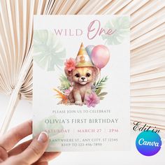 a person holding up a birthday card with a teddy bear wearing a party hat