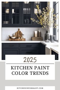 a kitchen with black cabinets and white counter tops, the words 205 kitchen paint color trends