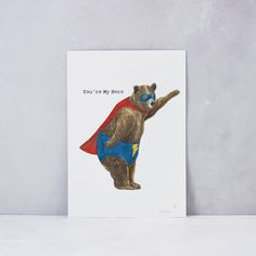 a card with a bear dressed as a superhero