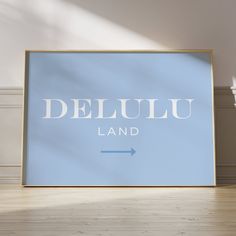 a blue poster sitting on top of a wooden floor