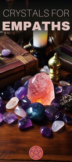 crystals for empaths on a table with books and candles in the background text reads crystals for empaths