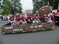 a group of people sitting in the back of a truck