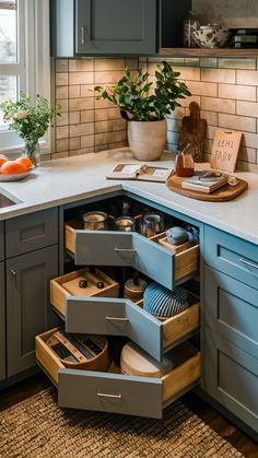 an open drawer in the corner of a kitchen