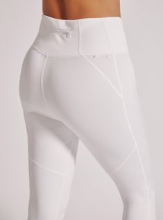 FEATURES & BENEFITS Back Zip Pocket In Seam 31" Leg Opening 10 1/2" High Rise FABRIC CONTENTS Self: 85% Nylon 15% Spandex Model is wearing size Small White Breathable Elastane Activewear, White Compressive Moisture-wicking Bottoms, White Nylon Activewear For Pilates, White Activewear With Go-dry Micro-elastic Fit, White Sporty Activewear With Elastane, White Elastane Sporty Activewear, White Sporty Activewear In Elastane, White Compressive Nylon Activewear, White Elastane Activewear For Pilates