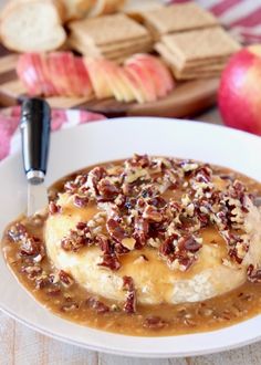 a white plate topped with food covered in gravy