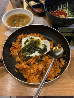 A nonstick pan filled with kimchi fried rice, topped with a fried egg and flakes of dried seaweed and a long-handled silver spoon Korean Fried Rice Aesthetic, Aesthetic Fried Rice, Fried Kimchi Rice, Kimchi Fried Rice Aesthetic, Kimchi Aesthetic, Fried Rice Aesthetic, Korean Fried Rice, Rice Aesthetic