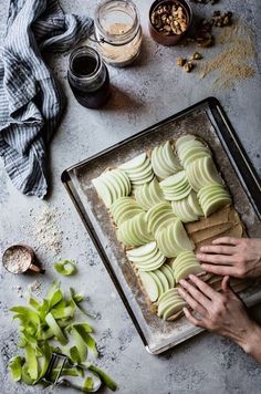 a pan filled with cut up cookies on top of a table next to other ingredients