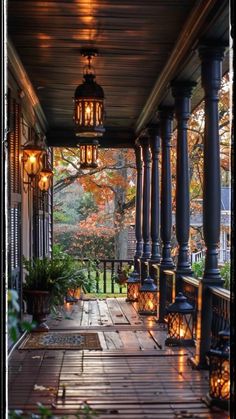 an outdoor porch with lanterns and plants on it